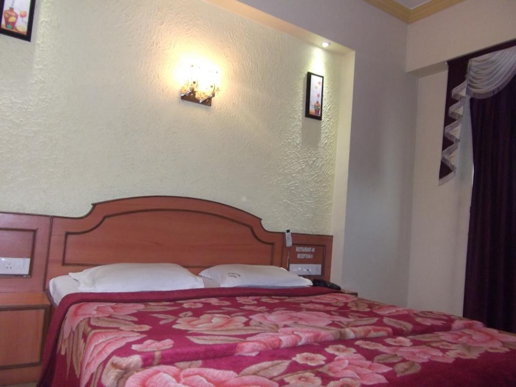 Hotel Ravikant Пюн Стая снимка